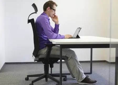 man sitting at desk