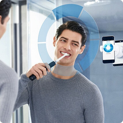 using Oral-B GENIUS 9000 electric toothbrus